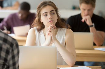 Young woman thinking of creative ideas.