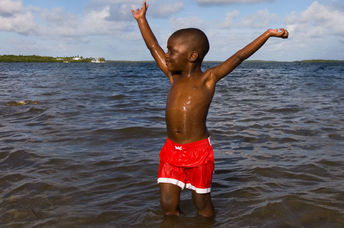 a boy's first time in the ocean.