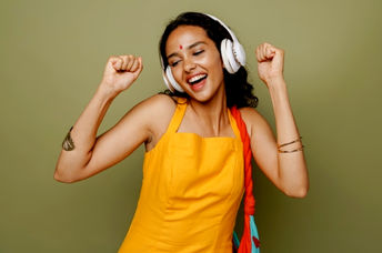 Young South Asian woman dancing.