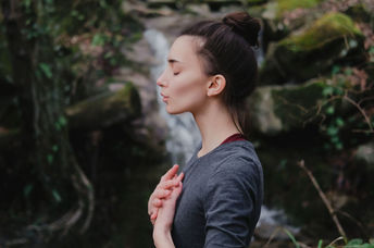 Woman practicing breathing exercises.