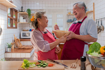 Senior couple preparing a healthy meal.