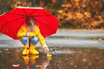Playing in the puddles during a springtime rain.