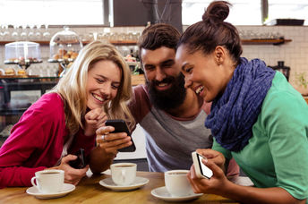 Three friends having coffee together.