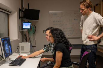 researchers looking at brain scans.