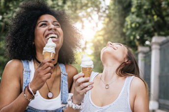 Two friends enjoying ice cream.