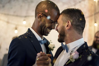 Two grooms at their same sex wedding.