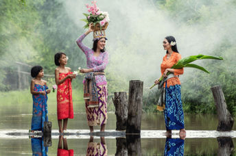 Balinese women preparing a traditional offering.
