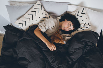 Woman getting a good night's sleep.