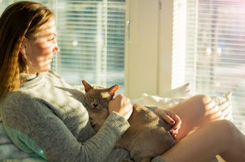 Woman in sunny room.