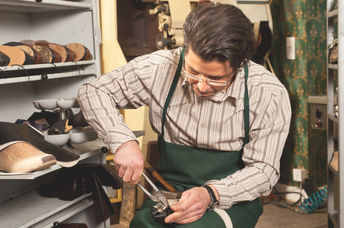 Shoemaker at work.