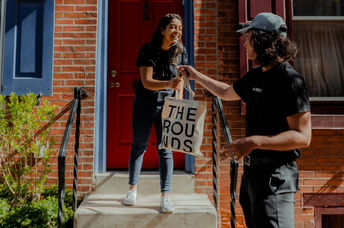 Groceries are delivered in reusable canvas bags.