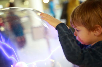 A young child studying science.