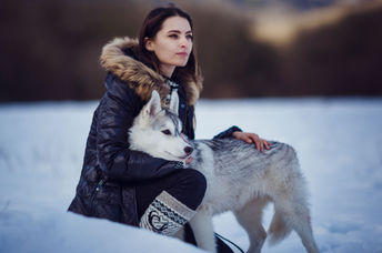 Indigenous woman with her dog companion.