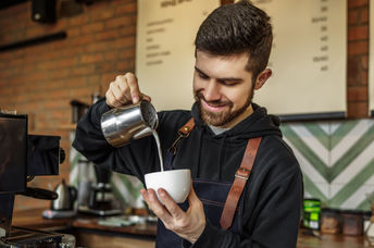 Barista making coffee.