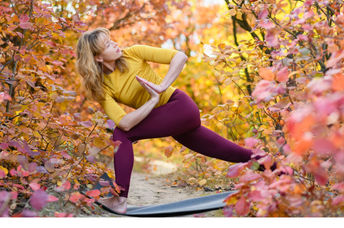 Practicing yoga amongst the autumn leaves. (O_Lypa / Shutterstock.com)