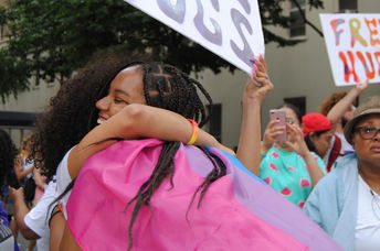 Giving a  stranger a hug is an act of kindness.