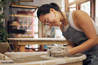 Potter working in clay or ceramics