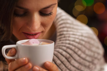 Enjoying a hot cocoa on a cold day.
