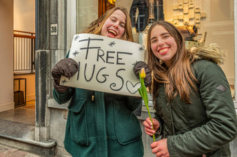 Give hugs to random people.