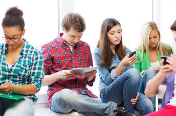 Students using smart devices.