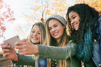 GenZ friends posting on social media.