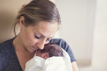 Cuddling a premature infant.