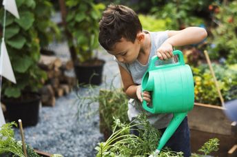 Helping to water a community garden.
