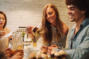 Next-gen friends eating out and enjoying time together.