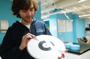 Making an album from captured plastic trash.