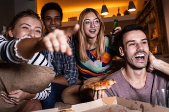 Friends watching TV.