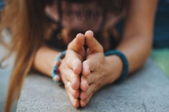 Spiritual woman expressing gratitude,