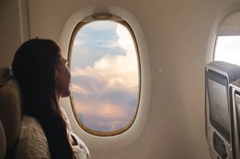 Calm woman on an airplane.