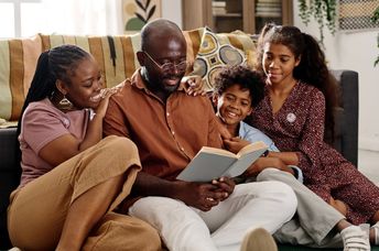 Reading books out loud as a family.