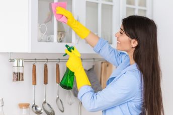 Woman spring cleaning her home.