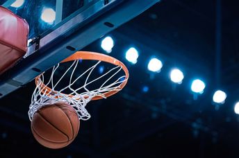 A basketball in the net.