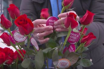 Giving out flowers on Good Deeds Day.