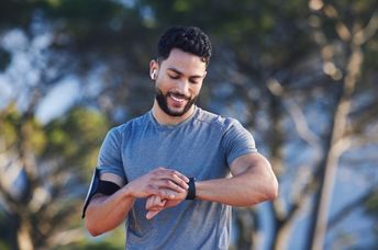 Man checking his oxygen rate while exercising.