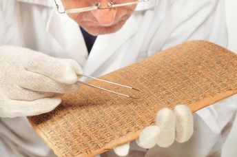 Scientist exploring ancient cuneiform.