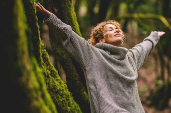 Happy woman enjoying being in nature.