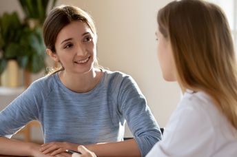 Two woman having a conversation.