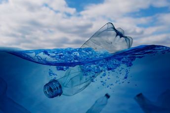 A plastic bottle floating in the ocean.