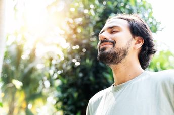 A man taking a meditative walk.