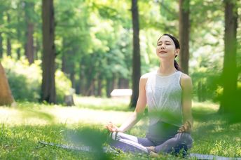 Woman meditating in nature.