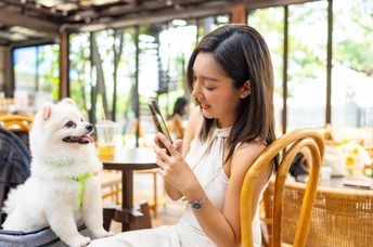 Pet parent posting a picture of having lunch with her baby.