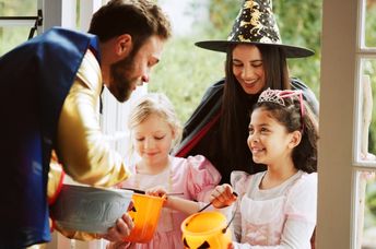 Handing out goodies to trick-or-treaters.