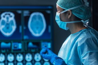 A team of medical doctors perform a surgical operation.