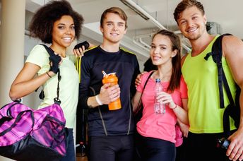 A group of friends in an aerobics class.