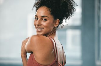 A woman stretches.