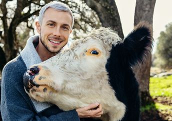 Nathan Runkle poses with a rescued cow