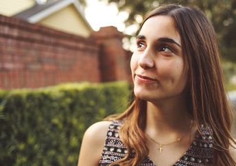 Young woman looking optimistically into the distance